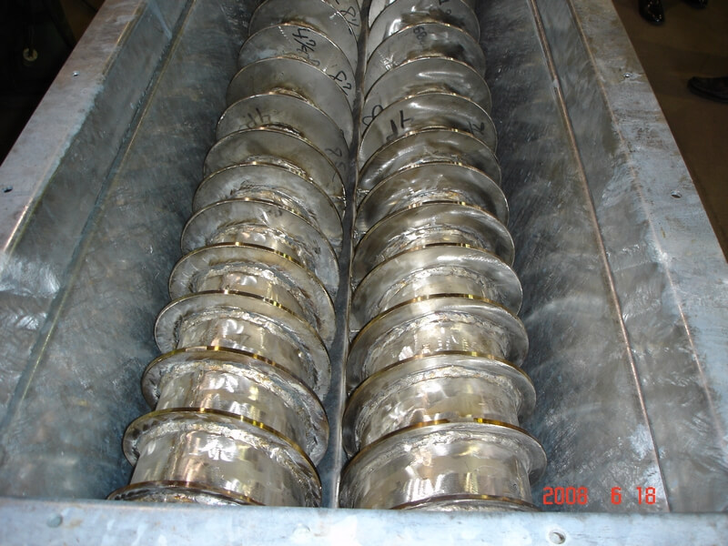 8-inch twin screw feeder flights in a trough for moving calcium chloride